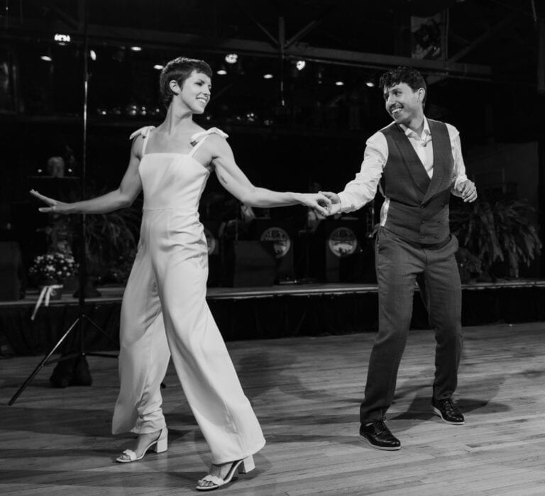 Danznik Studios Lindy Hop dance performance featuring Alejandro & Anna on stage.